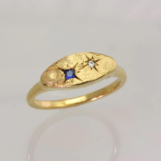 Anello Stella con zircone blu in oro